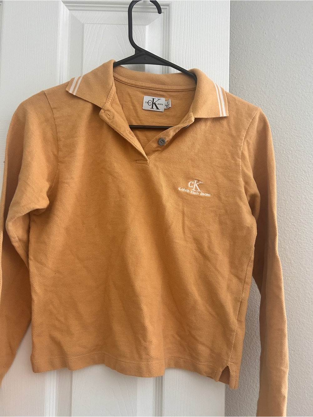 Calvin Klein women’s Mustard Long-Sleeve Polo Top